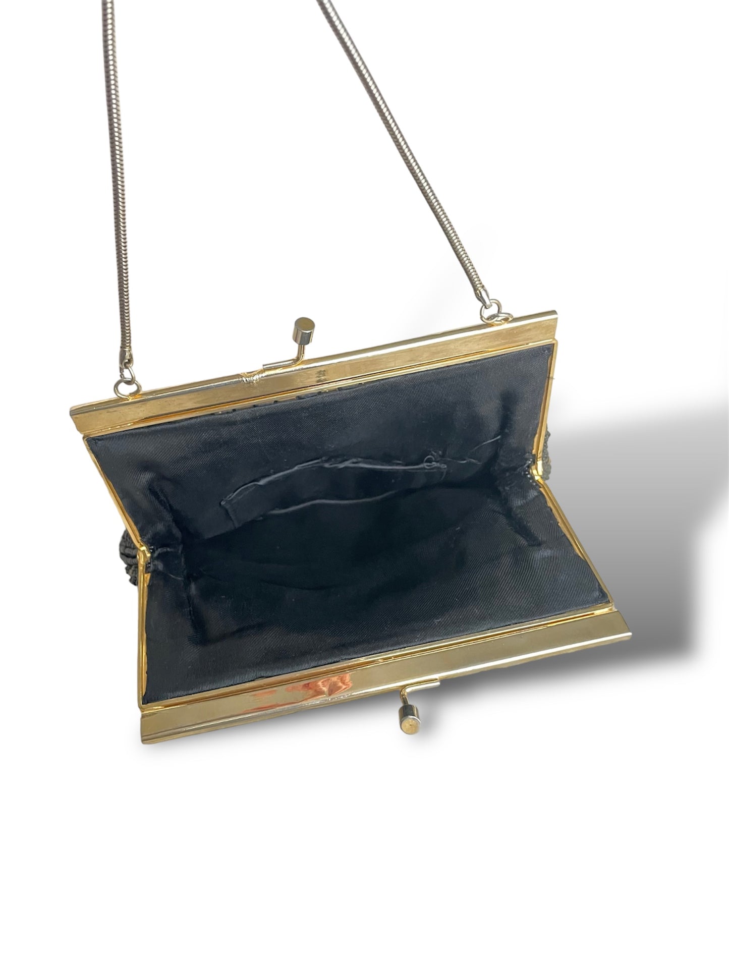 Minaudière à perles noires et dorées