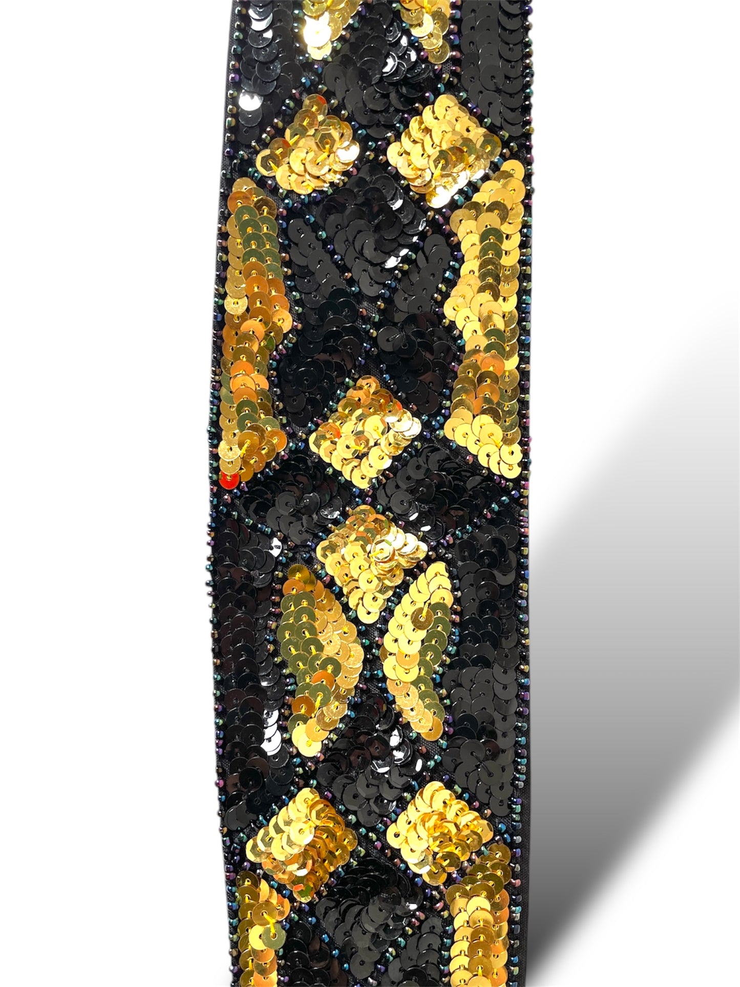 Ceinture à sequins noirs et dorés
