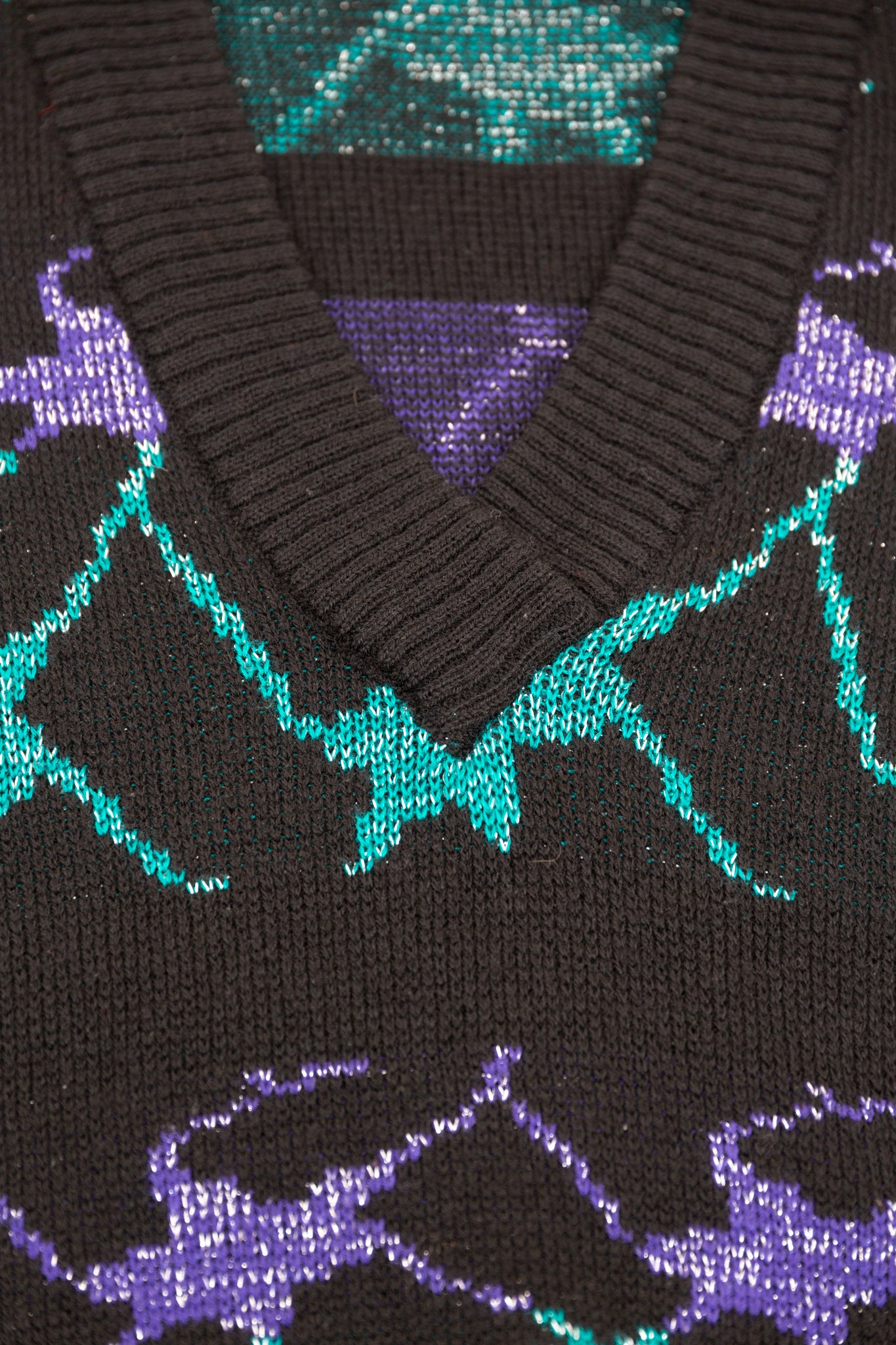 Pull sans manches noir, bleu et violet métallisés 42