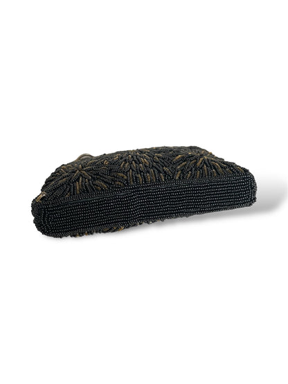 Minaudière à perles noires et dorées