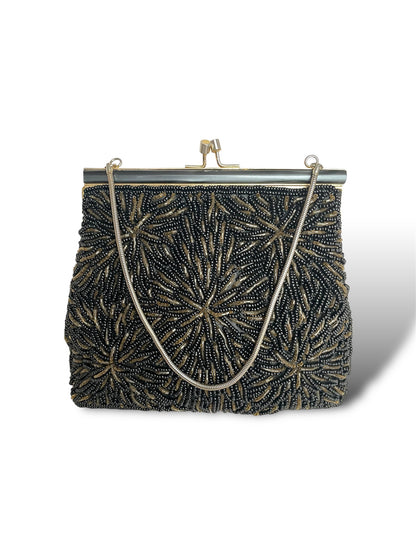 Minaudière à perles noires et dorées